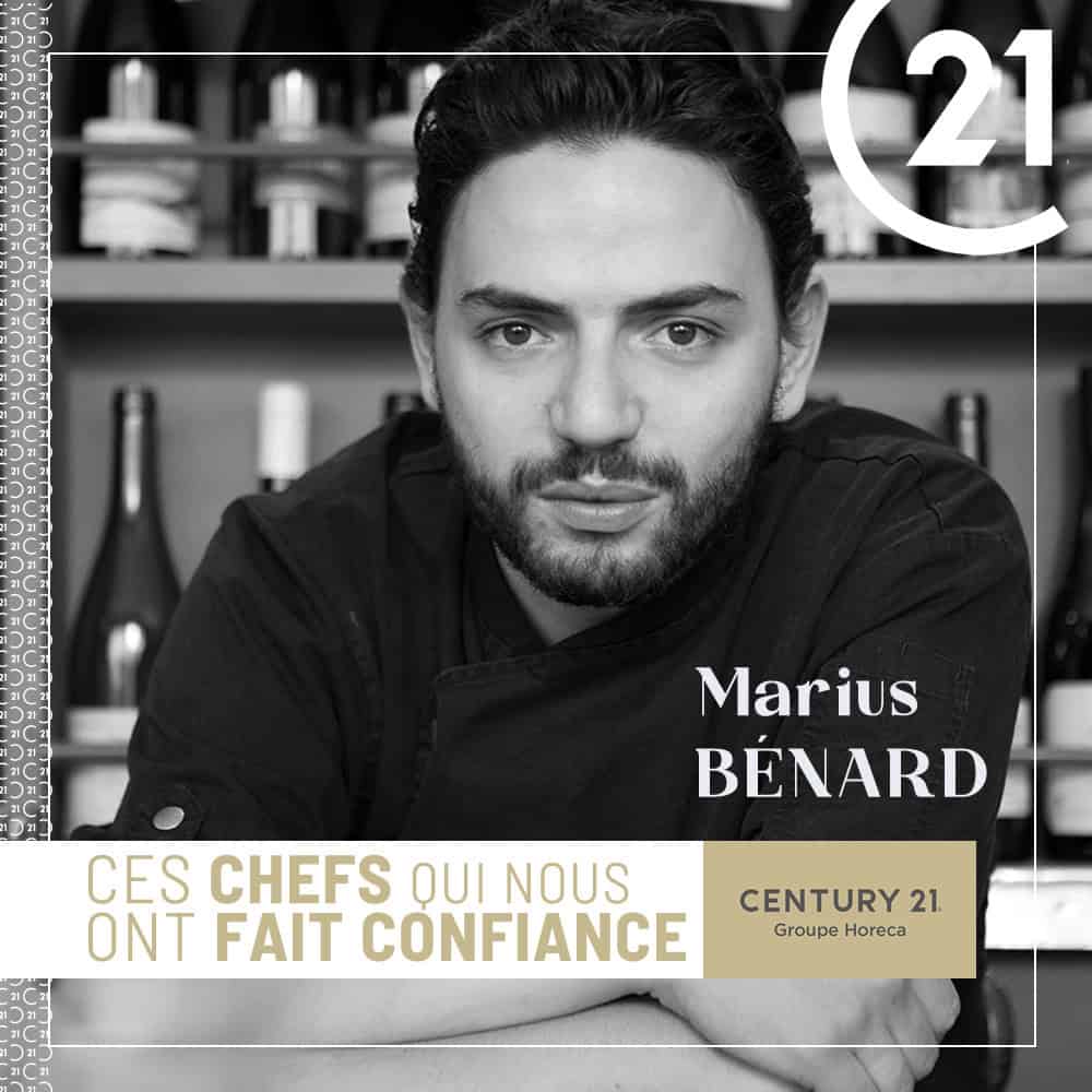Black-and-white portrait of chef Marius Bénard in a kitchen; features a Century 21 logo and a gold banner that reads 'CES CHEFS QUI NOUS ONT FAIT CONFIANCE'