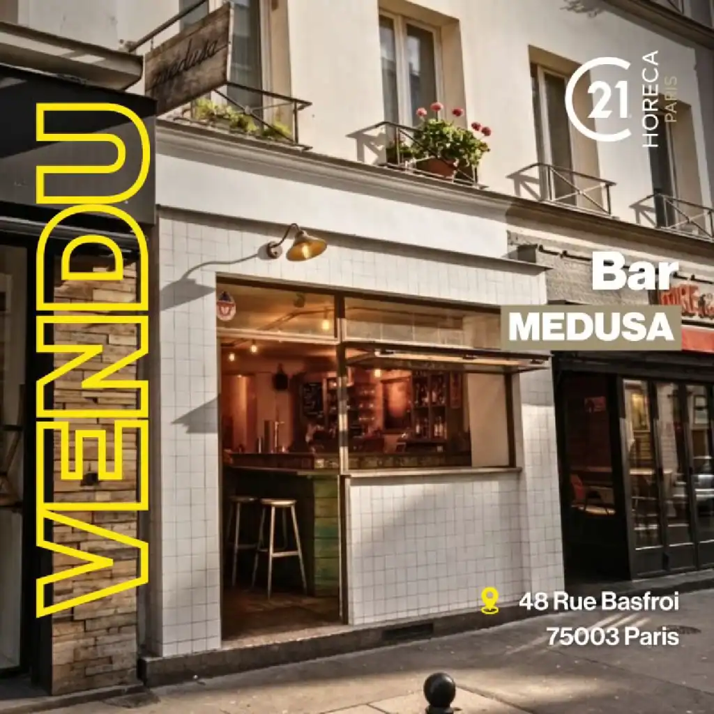 Exterior of a Parisian bar with a white tiled facade and open doorway; bright yellow vertical lettering on the left and 'Bar MEDUSA' signage with the address '48 Rue Basfroi, 75003 Paris' visible.